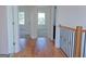 Open hallway with hardwood floors and views into bright, sunlit bedrooms at 721 Cascade Sw Ave, Atlanta, GA 30310