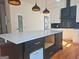 A kitchen island with white countertops and drawers at 721 Cascade Sw Ave, Atlanta, GA 30310