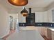 Kitchen island with overhead lights and matching cabinets and backsplash at 721 Cascade Sw Ave, Atlanta, GA 30310