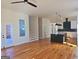 Open concept living area with hardwood floors and stairs at 721 Cascade Sw Ave, Atlanta, GA 30310