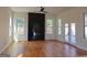 Bright living room featuring hardwood floors and a modern fireplace at 721 Cascade Sw Ave, Atlanta, GA 30310