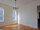 Sunlit room with hardwood floors, light walls, and windows at 721 Cascade Sw Ave, Atlanta, GA 30310