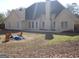 Expansive backyard featuring an outdoor seating area and patio at 180 Sunderland Cir, Fayetteville, GA 30215