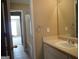 Well-lit bathroom features a single vanity, tile floor, and a shower/tub combo at 180 Sunderland Cir, Fayetteville, GA 30215