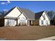Charming home with a well-manicured lawn, neutral siding, and an inviting entrance at 180 Sunderland Cir, Fayetteville, GA 30215