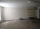 A functional garage features storage shelves and a smooth concrete floor at 180 Sunderland Cir, Fayetteville, GA 30215