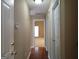Inviting hallway features neutral paint and flows into a carpeted room with bright natural light at 180 Sunderland Cir, Fayetteville, GA 30215