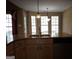 Kitchen island featuring a stainless steel sink and fixtures, with pendant lighting above at 180 Sunderland Cir, Fayetteville, GA 30215