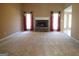 Spacious carpeted living room with stone fireplace, offering a cozy atmosphere and natural light at 180 Sunderland Cir, Fayetteville, GA 30215