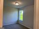Bedroom with neutral paint, carpeted floors, and a bright window at 4130 Chapel Hill Reserve, Douglasville, GA 30135