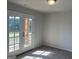 Bright bedroom with a private balcony through the double glass doors at 4130 Chapel Hill Reserve, Douglasville, GA 30135