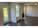 Open concept living room with fireplace and large windows with views to the backyard at 4130 Chapel Hill Reserve, Douglasville, GA 30135