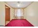 Bedroom featuring carpet, wallpaper border, and a window with floral curtains at 2759 Turner Valley Sw Cir, Conyers, GA 30094