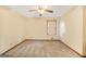 Cozy bedroom featuring carpet and natural lighting, with neutral colors and ceiling fan at 2759 Turner Valley Sw Cir, Conyers, GA 30094