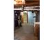 Unfinished basement space with utility connections, including a water heater, plumbing and sink at 2102 Mulkey Sw Rd, Marietta, GA 30008