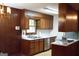 Kitchen features wood cabinets, white countertops, and stainless-steel appliances at 2102 Mulkey Sw Rd, Marietta, GA 30008