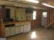 Interior view of a shed with wooden walls, built-in cabinets, a workbench, and shelving at 2102 Mulkey Sw Rd, Marietta, GA 30008