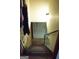 View of a stairway leading to the basement, featuring carpeted steps and a handrail at 2102 Mulkey Sw Rd, Marietta, GA 30008