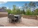 Large backyard deck with outdoor dining table seating for 8, great for enjoying outdoor meals at 3863 Rosebay Way, Conyers, GA 30094