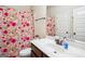 Bright bathroom featuring a colorful shower curtain and white vanity at 3863 Rosebay Way, Conyers, GA 30094