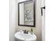 Stylish powder room features a pedestal sink and modern fixtures, creating a clean and elegant space at 3863 Rosebay Way, Conyers, GA 30094