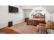Bedroom featuring a large bed with ornate wood frame and a cozy armchair at 3863 Rosebay Way, Conyers, GA 30094