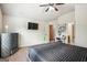 Bedroom with a bed, dresser, and en-suite bathroom at 3863 Rosebay Way, Conyers, GA 30094