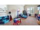 A bedroom featuring a basketball hoop and various colorful toys at 3863 Rosebay Way, Conyers, GA 30094