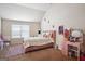 Bedroom featuring light pinks, a sunny window, and a vanity at 3863 Rosebay Way, Conyers, GA 30094