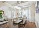 This dining room features elegant decor, a dining table set for six, and an elegant chandelier at 3863 Rosebay Way, Conyers, GA 30094