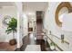 Elegant foyer features hardwood floors, a staircase, and a decorative mirror over an accent table at 3863 Rosebay Way, Conyers, GA 30094