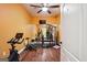 Home gym featuring exercise machines, a large mirror, and hardwood floors at 3863 Rosebay Way, Conyers, GA 30094