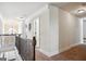 Hallway with carpet, railings, and a view of a chandelier at 3863 Rosebay Way, Conyers, GA 30094