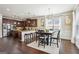 Spacious kitchen features dark wood cabinets, granite countertops, stainless steel appliances, and a breakfast nook at 3863 Rosebay Way, Conyers, GA 30094