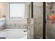 Bathroom features a large tub and standalone shower with gray tiling at 3863 Rosebay Way, Conyers, GA 30094