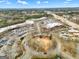 Aerial shot of a shopping center, featuring plentiful parking and bustling commercial activity at 211 Collierstown Way, Peachtree City, GA 30269
