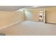 Finished basement with carpet flooring, beige walls, and a doorway leading to another room at 211 Collierstown Way, Peachtree City, GA 30269