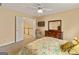 Bedroom with neutral paint, wooden furniture and doorway to upstairs landing at 211 Collierstown Way, Peachtree City, GA 30269