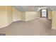 Finished bonus room with dormer windows and ceiling fan at 211 Collierstown Way, Peachtree City, GA 30269