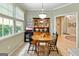 Cozy dining area with vintage-style table and decorative hutch at 211 Collierstown Way, Peachtree City, GA 30269