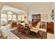 Cozy dining area with wood table and chairs, flowing into the living area at 211 Collierstown Way, Peachtree City, GA 30269