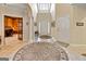 Open foyer featuring tile floors, arched entryways, and views into a study at 211 Collierstown Way, Peachtree City, GA 30269