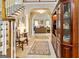 Grand foyer featuring elegant staircase, tiled floors, and views of the living room at 211 Collierstown Way, Peachtree City, GA 30269