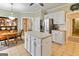 Spacious kitchen with island and stainless steel refrigerator at 211 Collierstown Way, Peachtree City, GA 30269