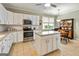 Well-equipped kitchen with stainless steel appliances and ample counter space at 211 Collierstown Way, Peachtree City, GA 30269