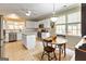 Bright kitchen with white cabinets, stainless steel appliances, and breakfast table at 211 Collierstown Way, Peachtree City, GA 30269