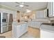 Modern kitchen with stainless steel refrigerator and center island at 211 Collierstown Way, Peachtree City, GA 30269