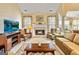 Inviting living room with fireplace, TV, and comfortable seating arrangement at 211 Collierstown Way, Peachtree City, GA 30269