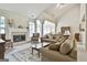 Spacious living room with a fireplace, vaulted ceilings, and comfortable seating at 211 Collierstown Way, Peachtree City, GA 30269