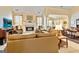 Spacious living room features fireplace, plush seating, and natural light at 211 Collierstown Way, Peachtree City, GA 30269